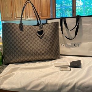 Gucci **mint condition** reversible tote solid black and iconic brown logo